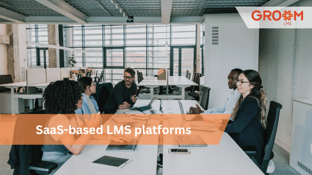 Team collaborating in a modern office, representing SaaS-based LMS platforms that simplify employee training, online learning, and corporate skill development with GroomLMS.