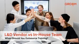 Team of professionals collaborating in a meeting representing the decision between an L&D vendor and an in-house training team.