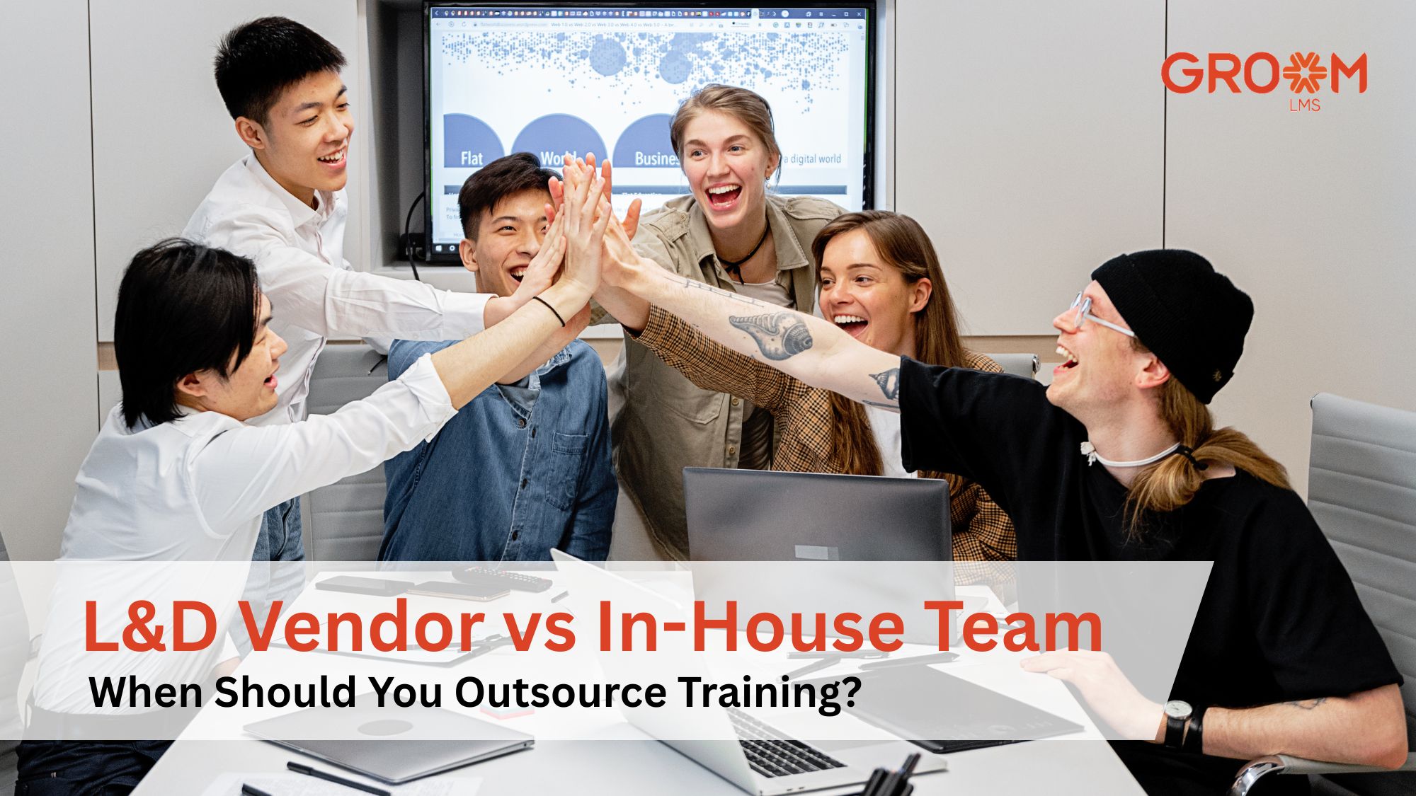 Team of professionals collaborating in a meeting representing the decision between an L&D vendor and an in-house training team.