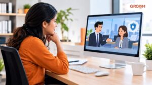 Employee watching an animated workplace compliance training scenario on a computer in a modern office.