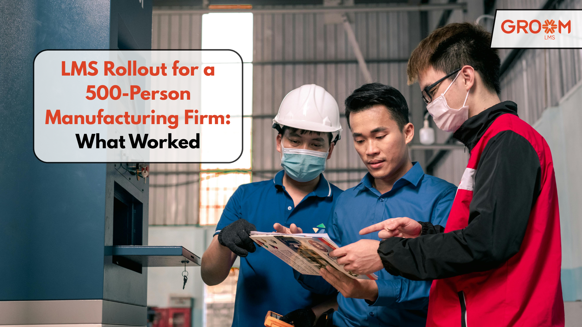 Manufacturing employees reviewing documents during an LMS rollout and workplace training session.
