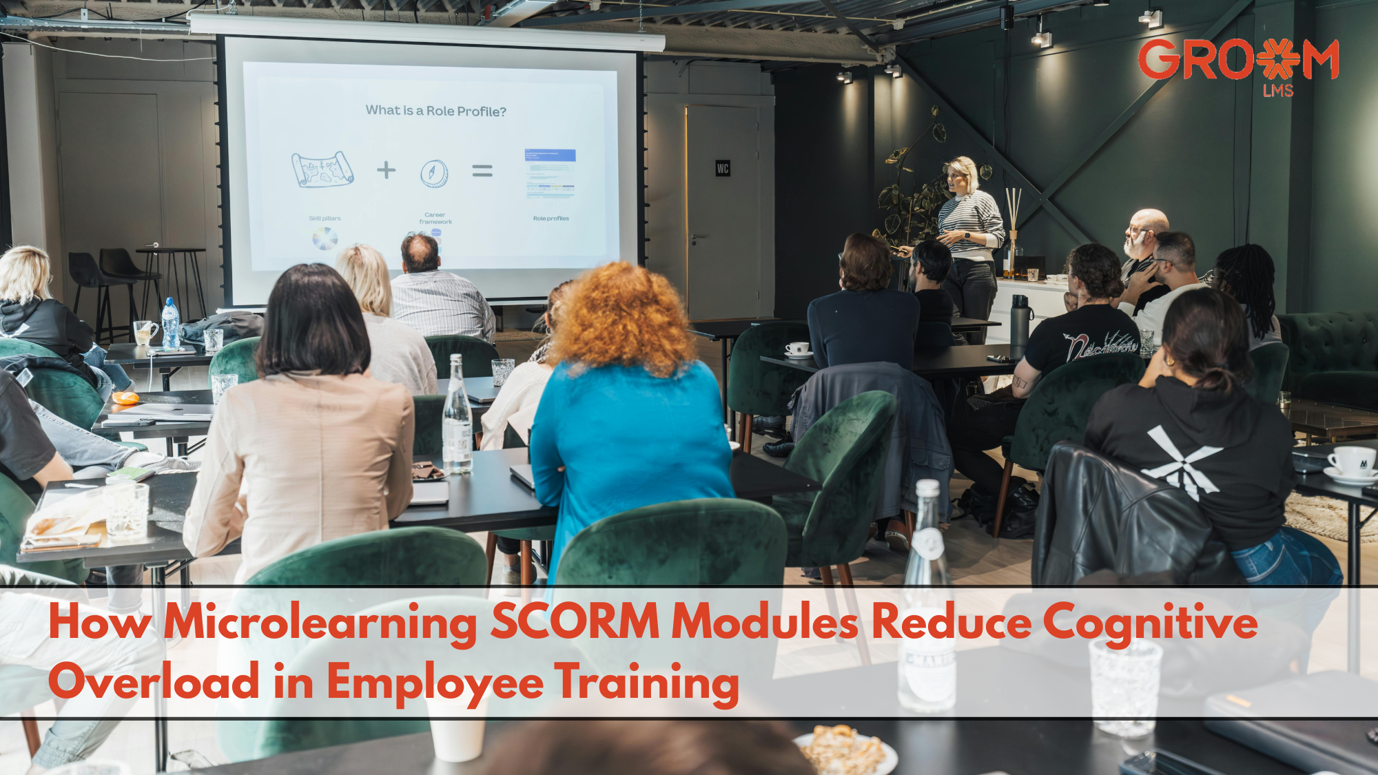 Employees participating in a microlearning SCORM training session with a presentation on reducing cognitive overload.