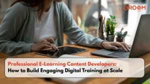 Professional creating digital training content using a laptop and tablet with GroomLMS branding.