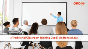 Employees attending a traditional classroom training session with an instructor presenting at the front.