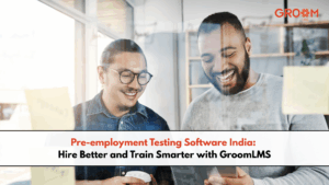 Two professionals collaborating with a tablet, representing pre-employment testing, hiring, and employee training with GroomLMS.