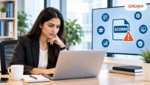 Employee reviewing SCORM compliance issues during online training in a modern office