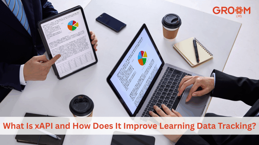 Professionals reviewing xAPI learning analytics on digital devices during a workplace training session.