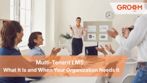 Business team attending a corporate training session demonstrating how a multi-tenant LMS helps organizations manage and scale learning across multiple teams.