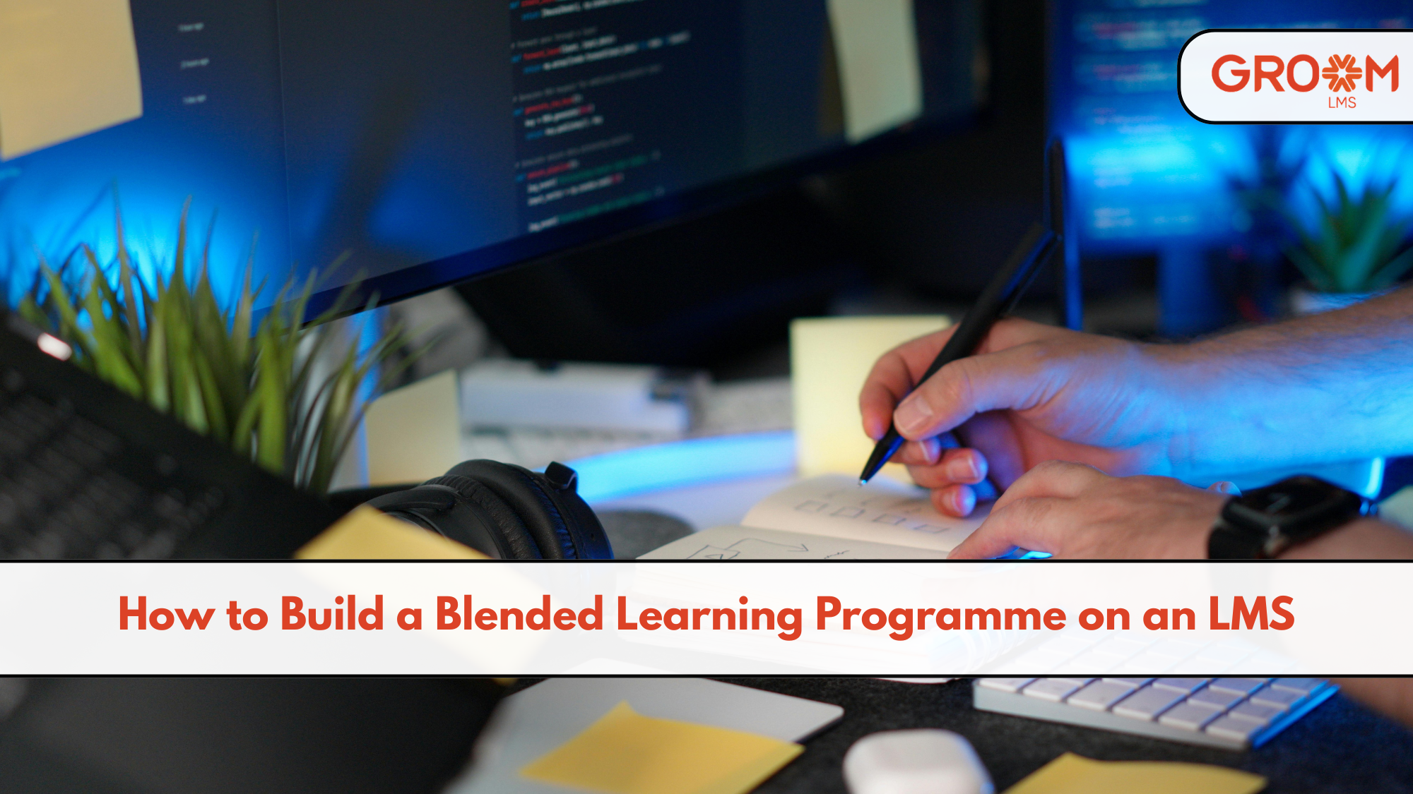 Laptop displaying a blended learning programme on an LMS with online modules, live sessions, classroom training, assessments, and learner progress tracking.