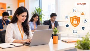 Employees completing online compliance training in a professional workplace