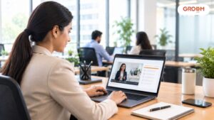 Employee participating in online compliance training at a modern workplace using a laptop