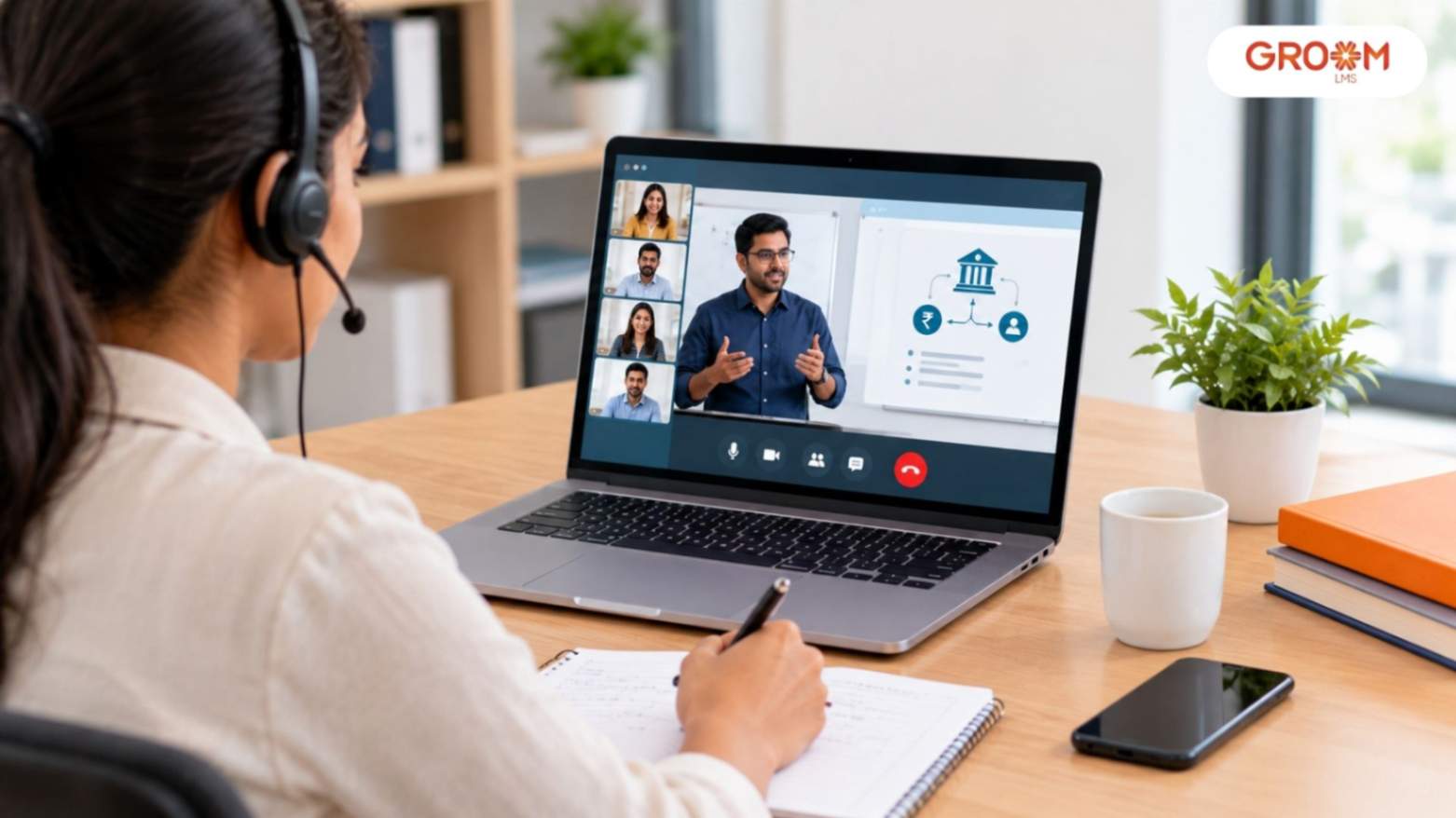 A professional employee attending a virtual classroom session on banking services, with an instructor and other learners displayed on a laptop.