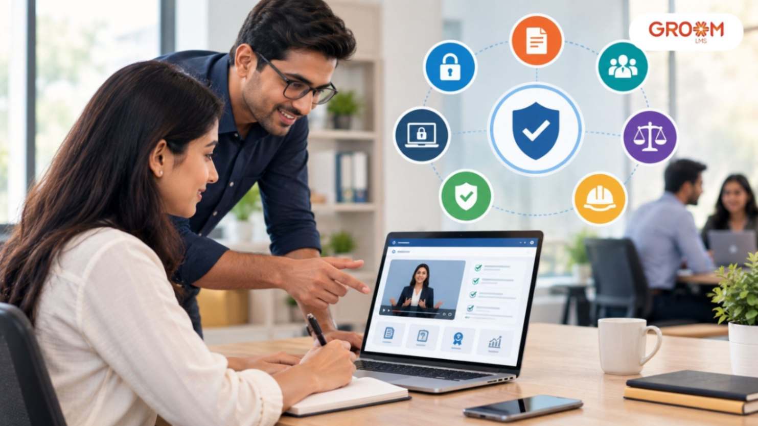 Employees participating in workplace compliance digital training in a modern office